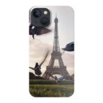 Flight of pigeons flying above grass field near eiffel tower in paris